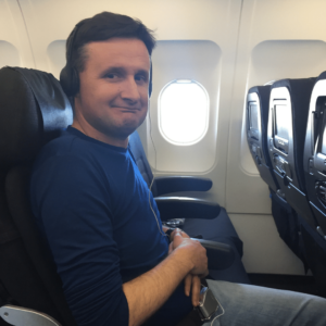 Tony Rogic Sits inside plane